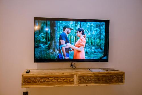 a flat screen tv sitting on a wall at Emerald Bay Resort Mirissa in Mirissa