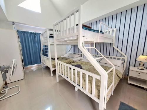 a bedroom with two bunk beds and a staircase at Pool Marine Hua-Hin Private Poolvilla from beach 4 km in Hua Hin