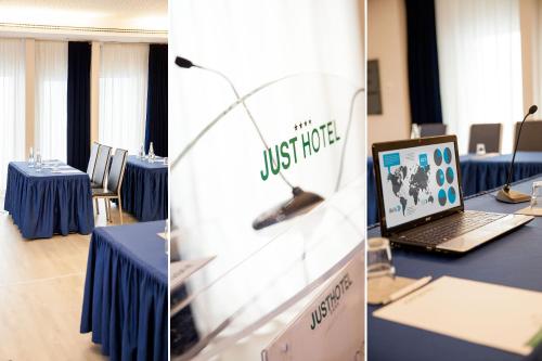 a meeting room with blue tables and a laptop at Just Hotel Lomazzo Fiera in Lomazzo