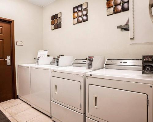 a row of washers and dryers in a kitchen at Comfort Suites Independence - Kansas City in Independence