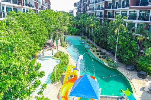 a water park with a pool and a water slide at Centara Life Maris Resort Jomtien in Jomtien Beach