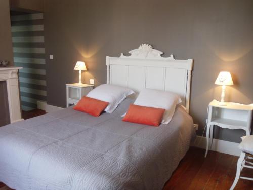 Ein Bett oder Betten in einem Zimmer der Unterkunft La Pommeraie