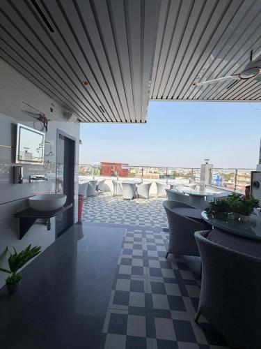 a bathroom with sinks and toilets in a building at Hotel Aveda Paradise in Varanasi