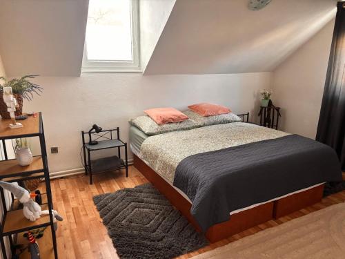a bedroom with a bed and a window at Diana in Revúca