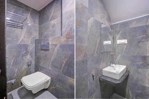 a bathroom with a toilet and a sink at FabHotel Beverly Plaza in Mumbai