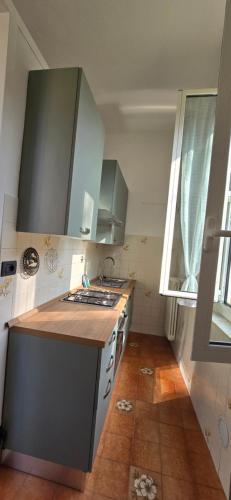 a kitchen with a stove and a counter top at The SISTERS in Castel Maggiore