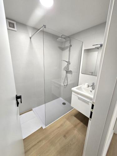 a bathroom with a shower and a sink at Apartmány ALMA Šumiac in Šumiac