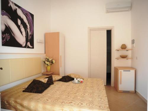 a bedroom with a large bed in a room at Bed & Breakfast Villa Corallo Parcheggio privato in Porto Cesareo