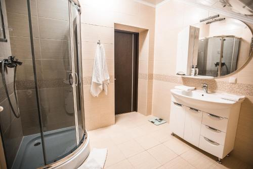 a bathroom with a shower and a sink at Dolce Vita in Bukovel