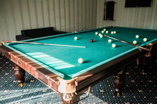 a pool table with balls on top of it at Dolce Vita in Bukovel