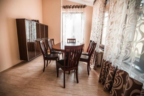 a dining room with a table and chairs at Dolce Vita in Bukovel