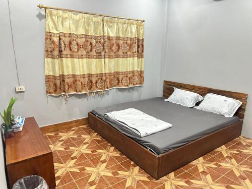 Llit o llits en una habitació de Fundee Guesthouse
