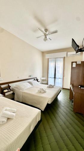 Postel nebo postele na pokoji v ubytování Hotel B&B Avana