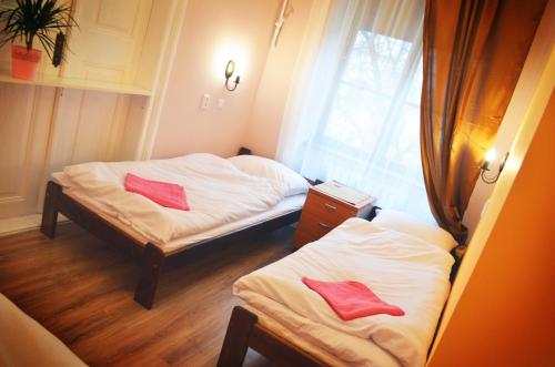 Postel nebo postele na pokoji v ubytování Hostel u Kmity