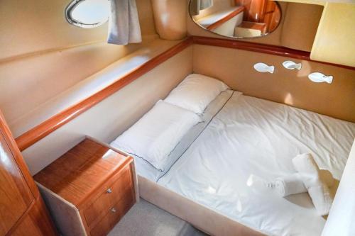 a small bed in the back of a boat at Yacht Experience in Monaco Harbour in Monte Carlo