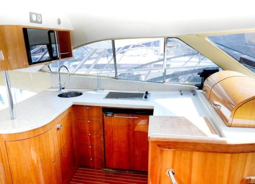 a kitchen in the middle of a boat at Yacht Experience in Monaco Harbour in Monte Carlo