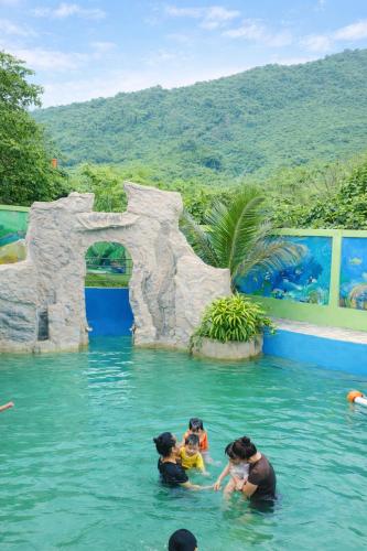 a group of people in the water at a water park at Thành An Homestay in Hòa Bình