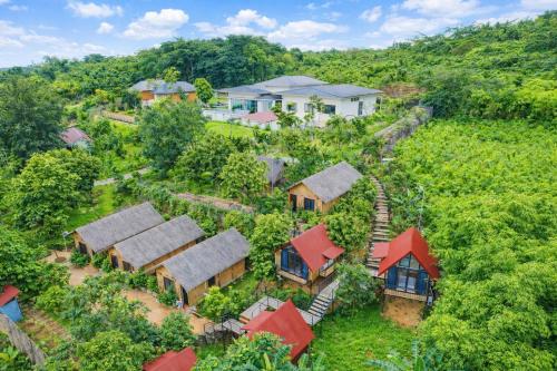 an overhead view of a village with houses and trees at Thành An Homestay in Hòa Bình