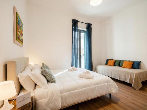 a bedroom with two beds and a window at Blu Mediterraneo 2 Bedrooms & 2 bathrooms in Bari