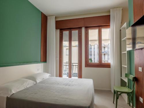 Postel nebo postele na pokoji v ubytování Hotel Jesulum