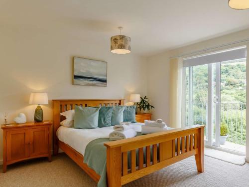 a bedroom with a bed with teddy bears on it at 4 Bed in Torpoint oc-89135 in Sheviock