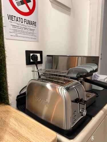 a toaster sitting on top of a kitchen counter at LE TEMPLE DU LUXE in Agrigento
