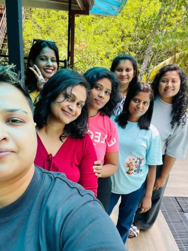 a group of women standing next to each other at THARUMINI villa in Kandy