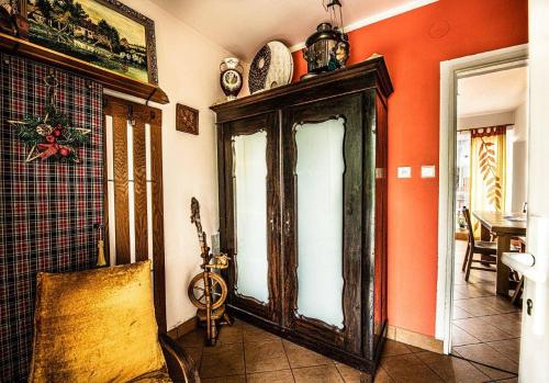 a room with a large wooden cabinet in the corner of a room at Petrův dům u mlýna in Slup
