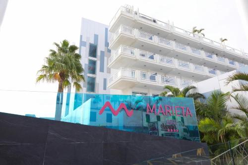 a large white building with a sign in front of it at BLUESEA Marieta & Spa in Playa del Ingles