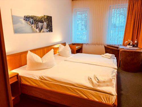 Giường trong phòng chung tại Hotel Nordwind