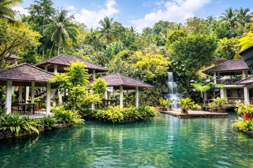 a resort with a pool and a fountain at Kamayan sa Palaisdaan Hotel and Resort Quezon in Lucban