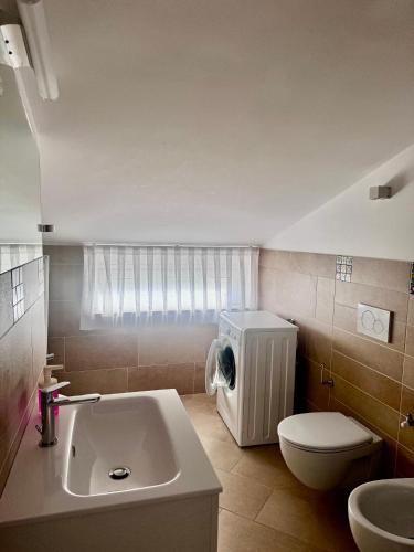 a bathroom with a toilet and a sink at MareVasto - appartamento Vasto Marina in Vasto
