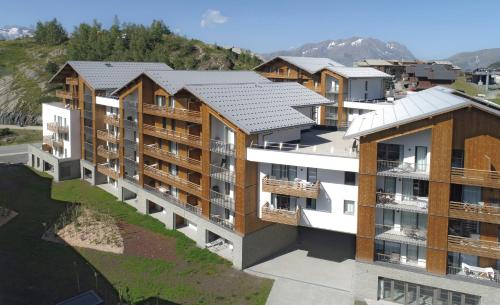 an aerial view of an apartment complex with buildings at Résidence Odalys l'Éclose in L'Alpe-d'Huez