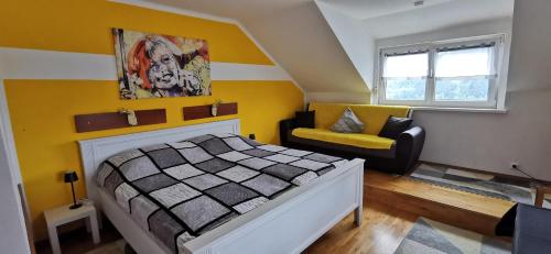 a bedroom with a bed and a couch at Lake View in Millstatt