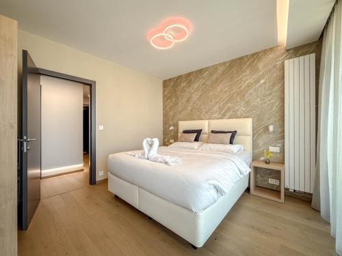 a bedroom with a large white bed in a room at Eurovea Tower Apartment 27th floor, Luxury bed VISPRING Baronet Superb in Ovsište