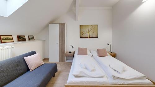 a living room with two beds and a couch at Pribina Penzión in Nitra