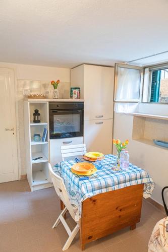 a kitchen with a table with a plate on it at La Casina Del Campese in Campese