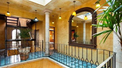 a hallway with a staircase in a building at Villa Santa Cruz in Todos Santos