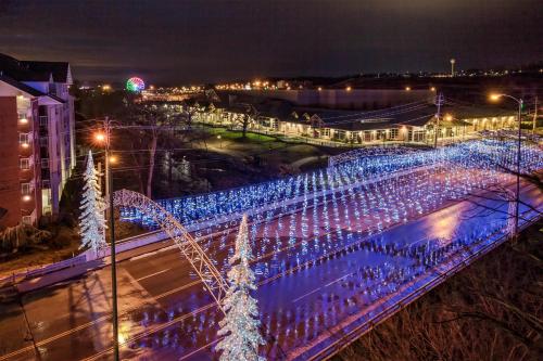 a bridge covered in blue lights at night at Black Fox Lodge Pigeon Forge, Tapestry Collection by Hilton in Pigeon Forge
