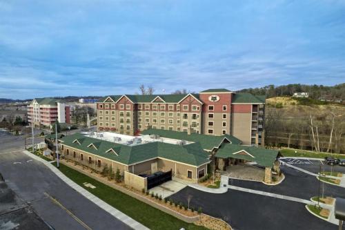 an aerial view of a large building with a green roof at Black Fox Lodge Pigeon Forge, Tapestry Collection by Hilton in Pigeon Forge