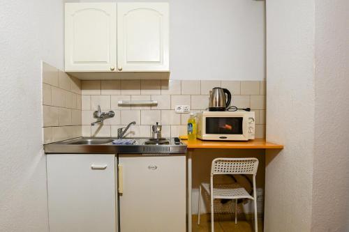 Kjøkken eller kjøkkenkrok på Abigél Apartmanház