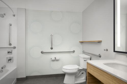 a bathroom with a toilet and a sink at Tru By Hilton Stockbridge in Stockbridge