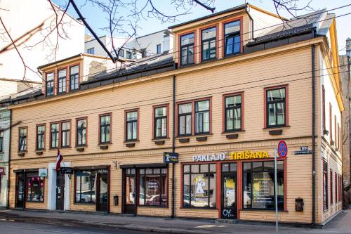 a large building on the corner of a street at Central Hostel in Riga