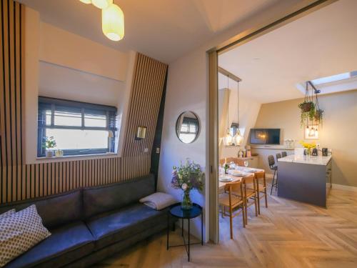 a living room with a couch and a table at Hosted by Wendy Prins Willem 3 in Scheveningen