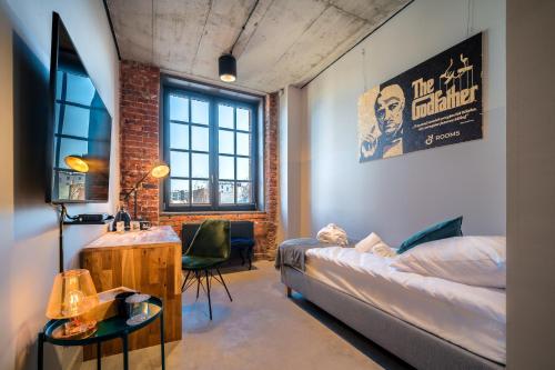 a living room with a couch and a table at ON Rooms Łódź in Łódź