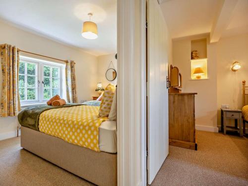 a bedroom with a bed and a window at 2 Bed in Alford oc-92252 in Rigsby