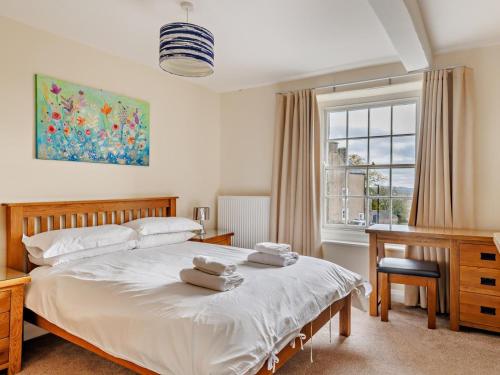 a bedroom with a bed and a desk and a window at 6 Bed in Buxton oc-77369 in Longnor