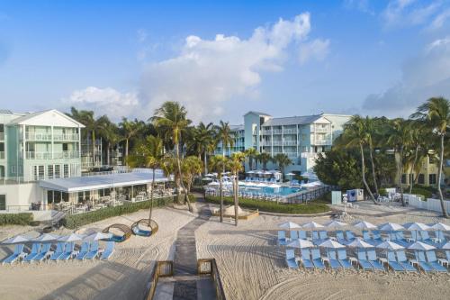 a view of a resort with lounge chairs and a pool at The Reach Key West, Curio Collection by Hilton in Key West