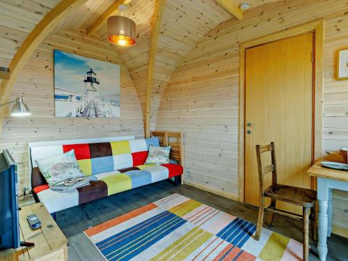 a living room with a couch in a cabin at 1 Bed in Shrewsbury oc-93395 in Leighton