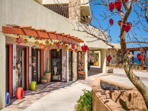 a building with red lanterns on the side of it at Waldorf Astoria Los Cabos Pedregal in Cabo San Lucas